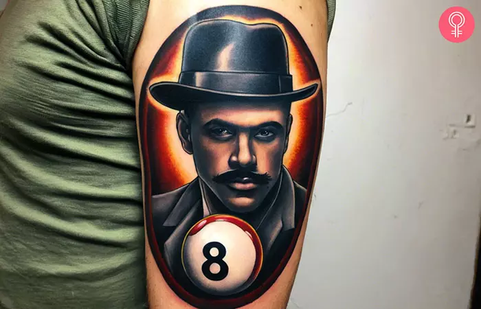 A gangster 8 ball tattoo on the arm