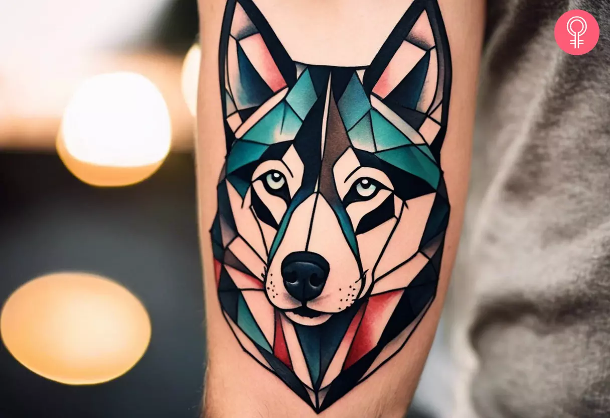 A geometric tattoo of a husky on the arm