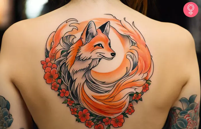 A kitsune tattoo on a woman’s upper back