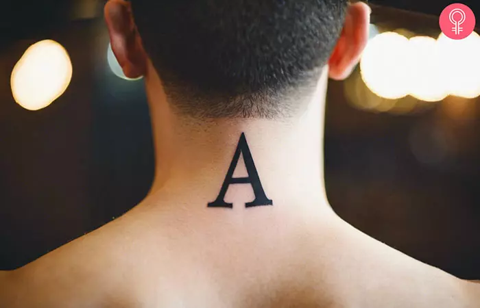 A letter A tattoo on a man’s neck
