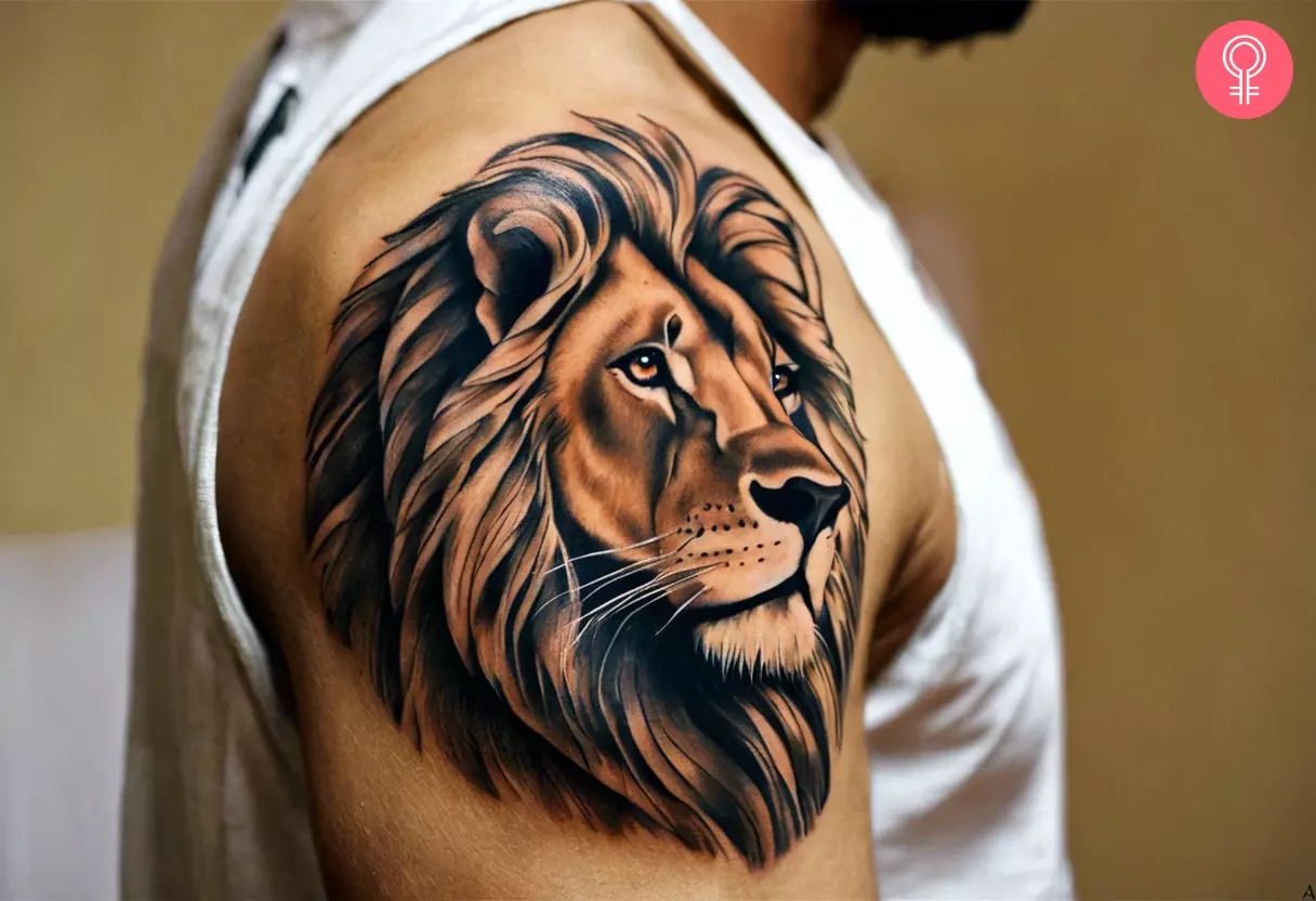 A lion tattoo on a man’s upper arm