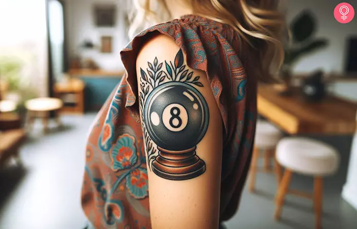 A magic 8 ball tattoo on the arm