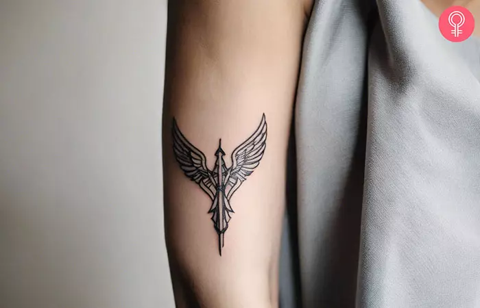 A minimalist Valkyrie tattoo on the arm