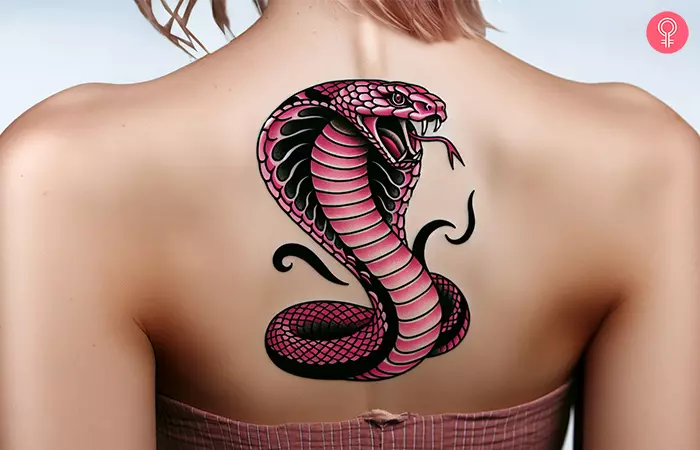 A pink cobra tattoo on the spine