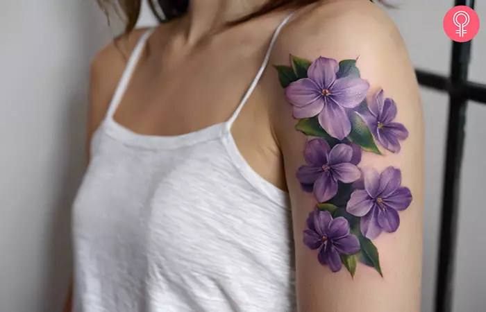 A realistic lilac tattoo on the arm