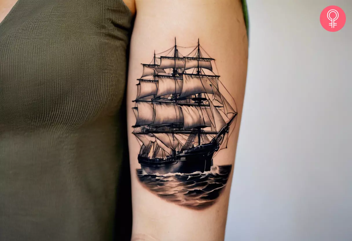 A realistic ship tattoo on the upper arm