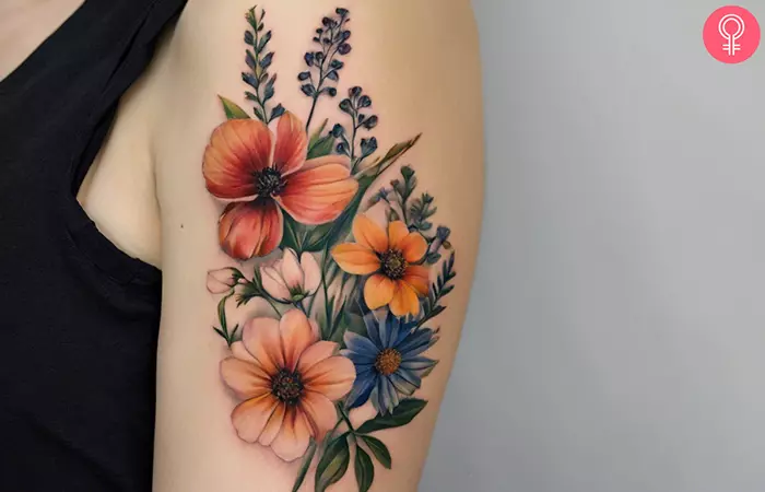 A realistic wildflower tattoo on the upper arm