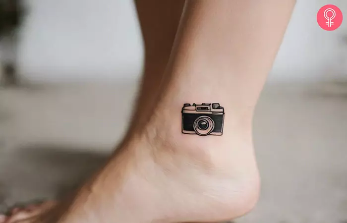 A small camera tattoo on the ankle