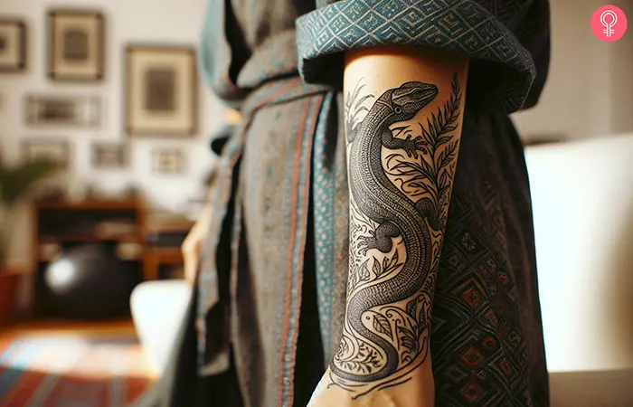 A tattoo featuring a lizard with a long tail