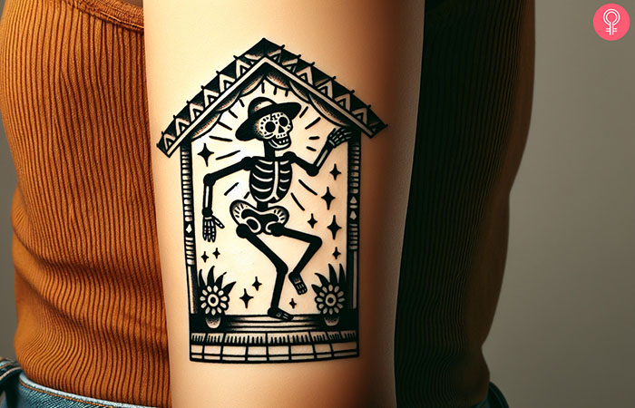 A tattoo of a dancing skeleton