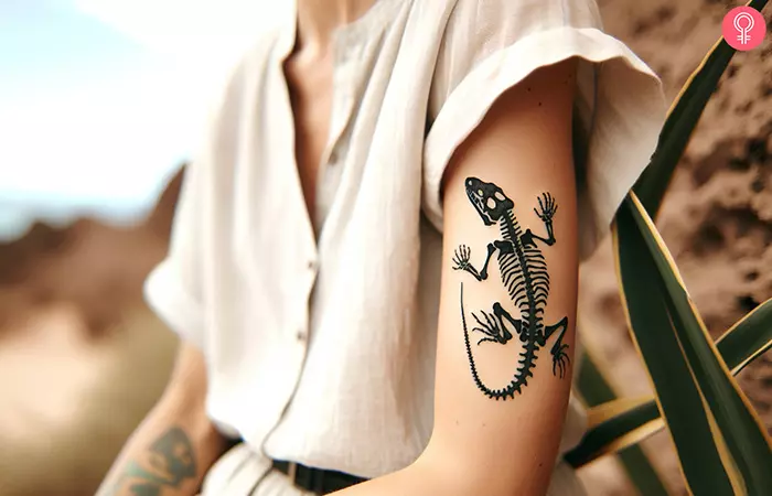 A tattoo of a lizard skeleton