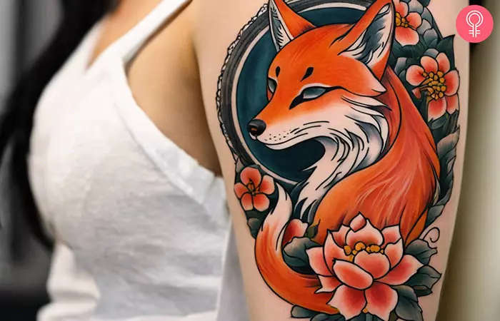 A traditional kitsune tattoo on a woman’s arm