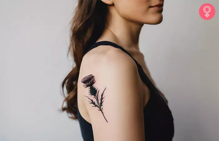 A traditional thistle tattoo on the shoulder