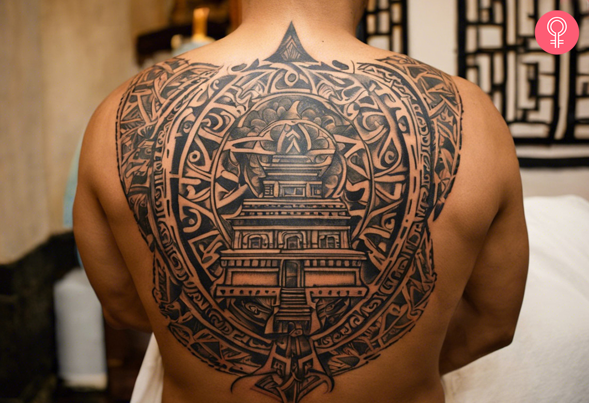 A tribal tattoo featuring a Mexican temple in black ink