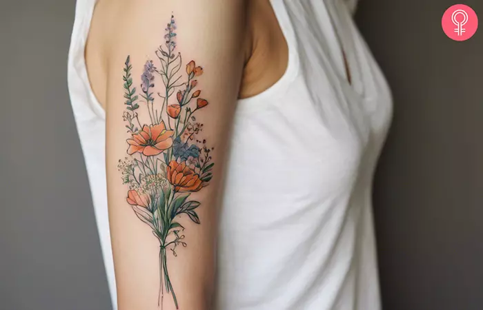 A wildflower bouquet tattoo on the arm