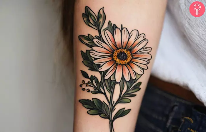 A wildflower daisy tattoo on the forearm