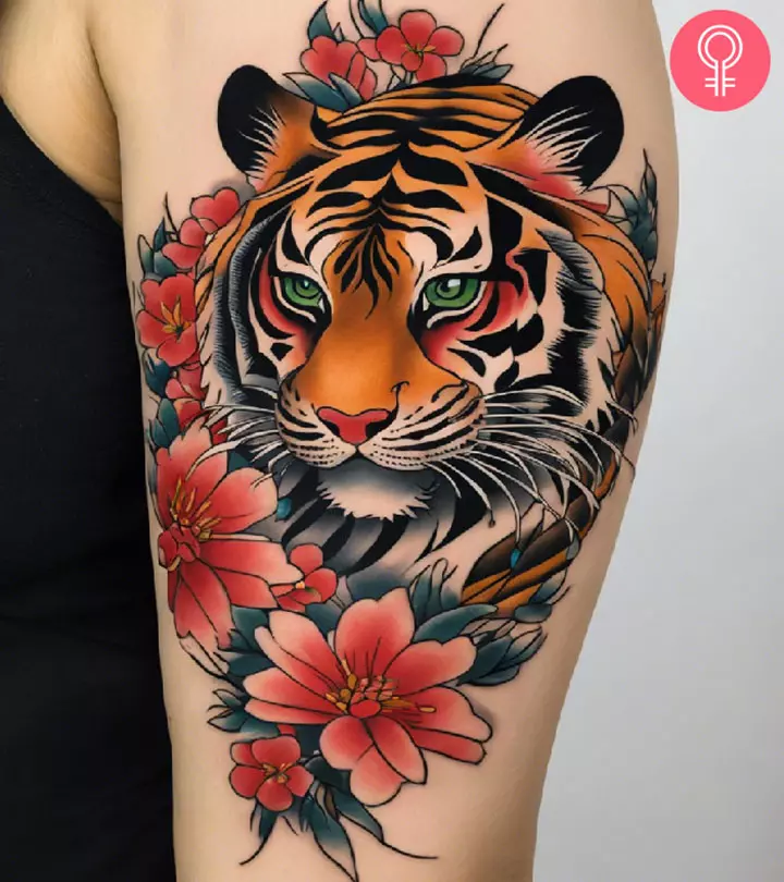 A woman with a Japanese tiger tattoo on her upper arm
