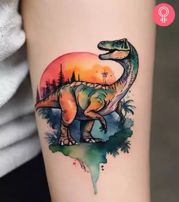 Velociraptor tattoo on the arm of a woman