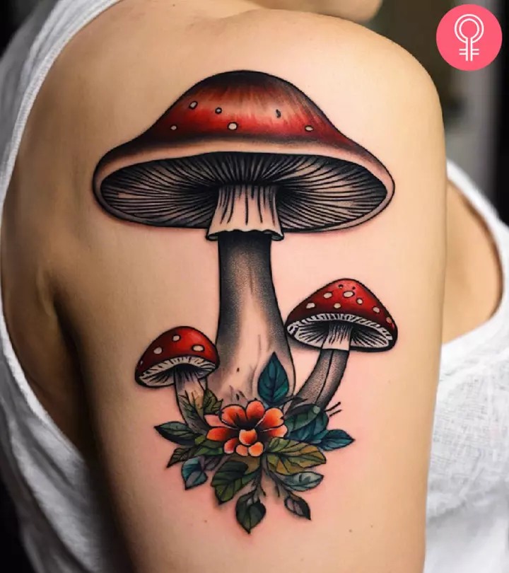A woman with a mushroom tattoo on her upper arm