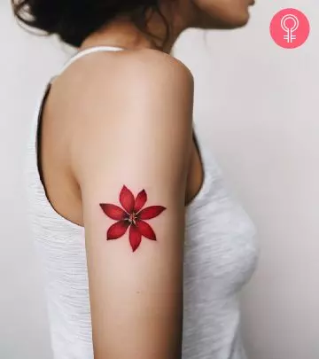 A woman sporting a tulip tattoo on the forearm