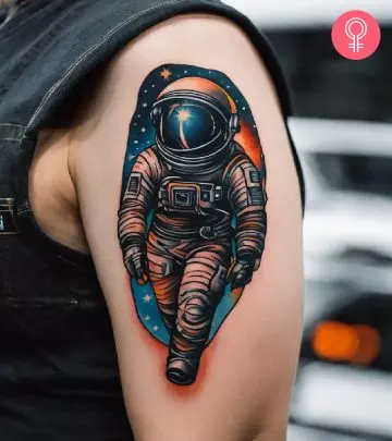 A woman with an astronaut tattoo on her arm.