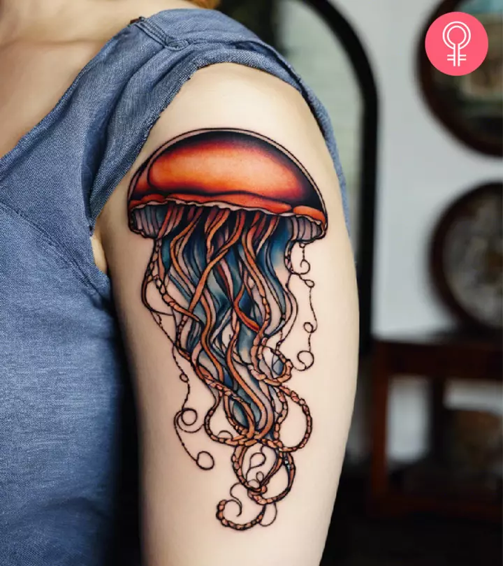 A woman with jellyfish tattoo on her upper arm