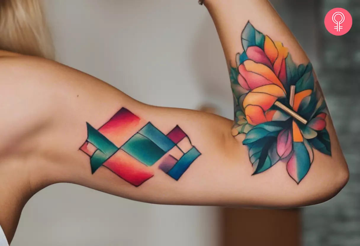 A colorful and abstract tattoo on the inner bicep