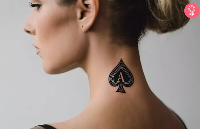 A woman with an ace of spades tattoo on the back of her neck