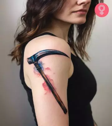 A woman with a skull and crossbones tattoo on her shoulder