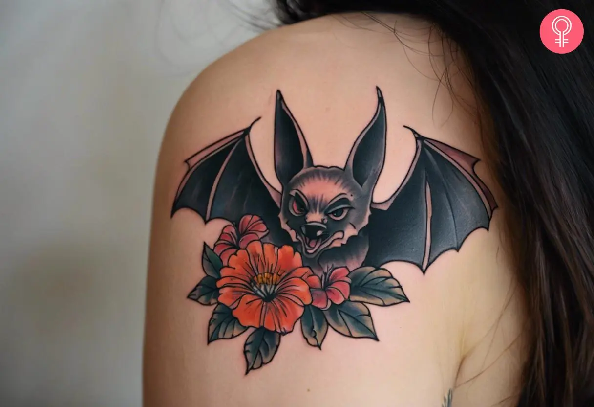 American traditional bat tattoo on a woman’s shoulder