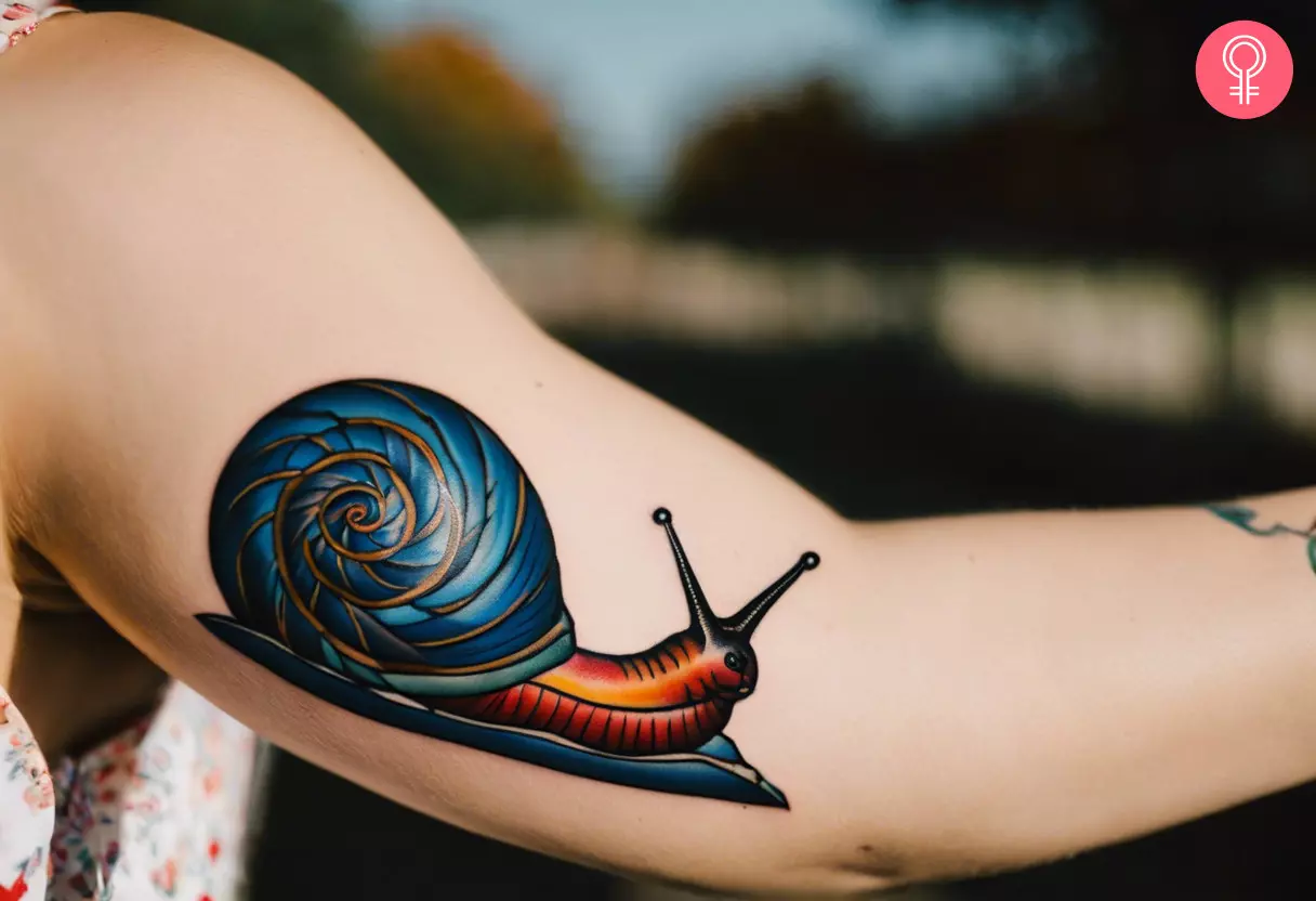 American traditional snail tattoo on the bicep