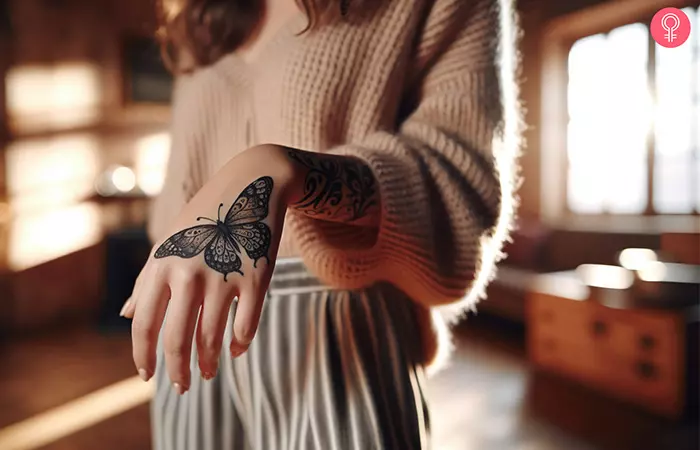 An anxiety tattoo design on the hand of a woman
