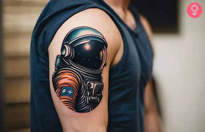 An astronaut space tattoo for men on the upper arm