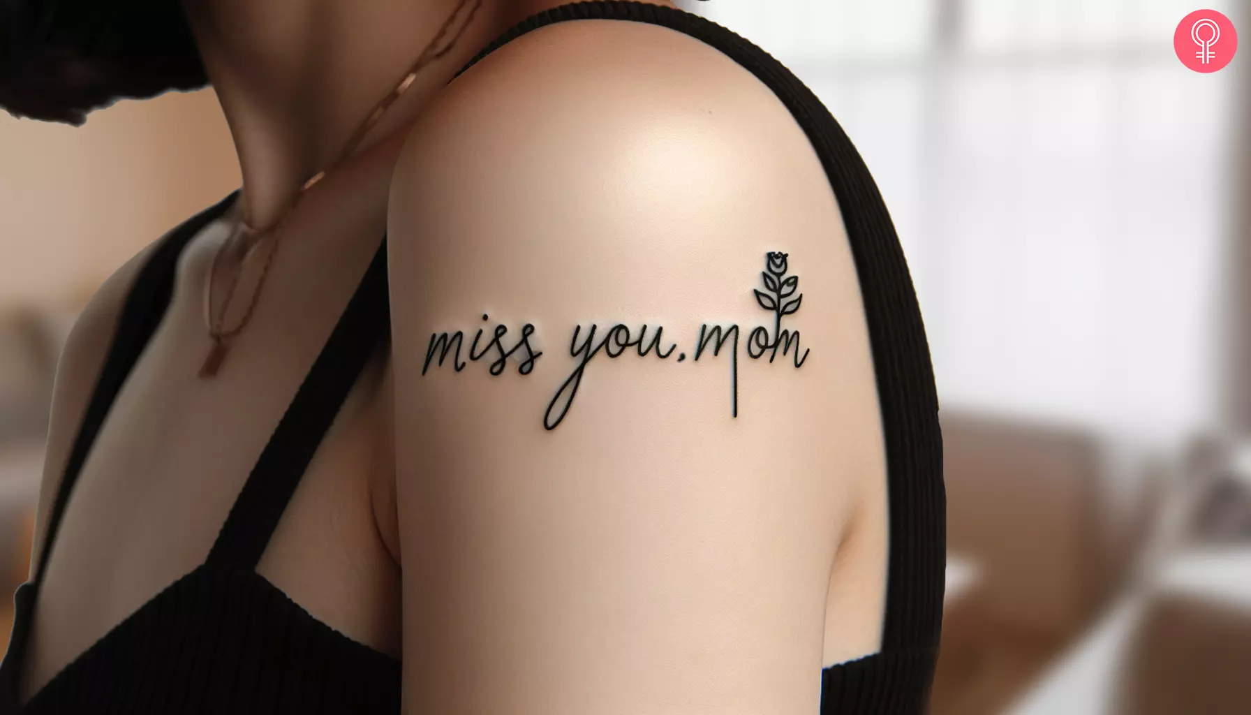 An upper arm tattoo saying “miss you, mom”