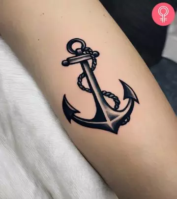 A woman with an anchor tattoo