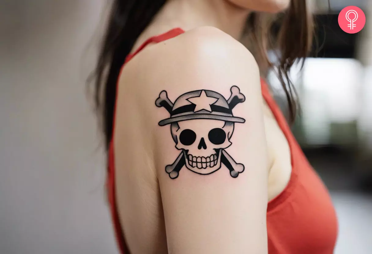 Anime One Piece skull tattoo on a woman’s arm