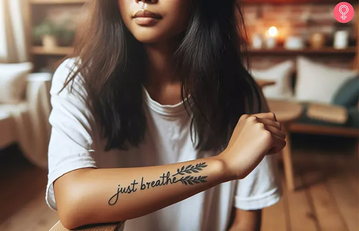 Anxiety just breathe tattoo on the forearm of a woman
