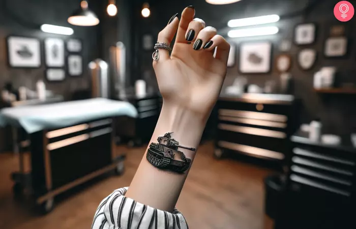 An army tank tattoo on the wrist of a woman
