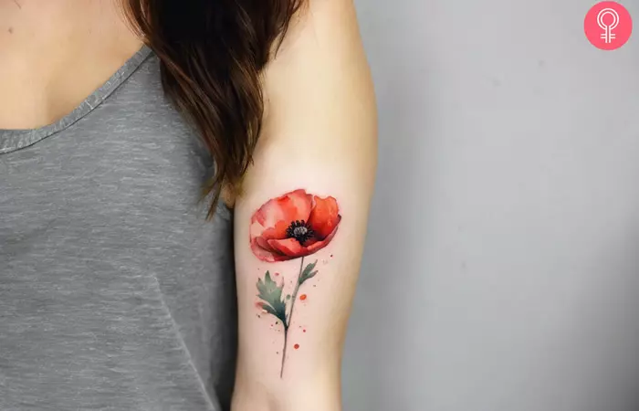 Poppy birth flower tattoo on the arm