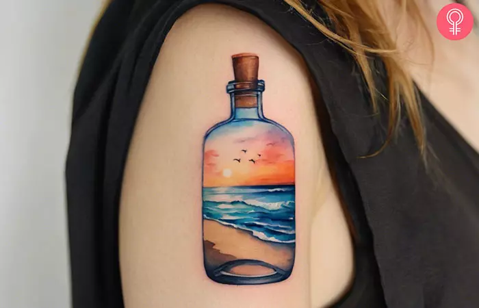 Woman with a beach scene tattoo