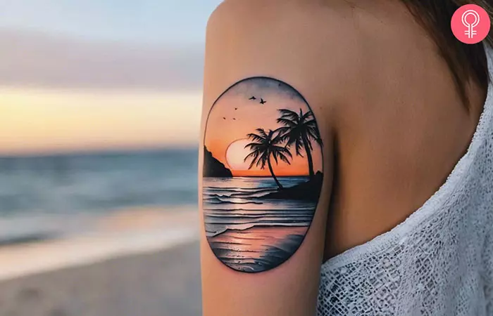 Woman with a beach sunset tattoo