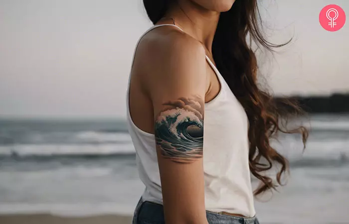 Woman with a beach wave tattoo