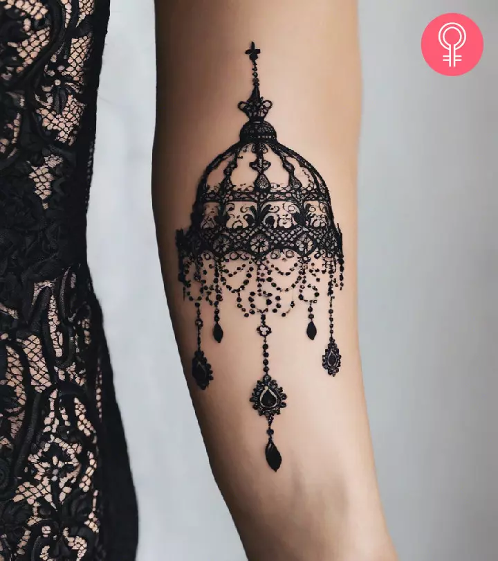 Beautiful chandelier tattoo design on the arm of a woman