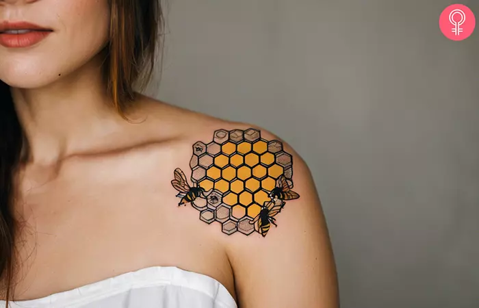 Bee and honeycomb tattoo on the shoulder