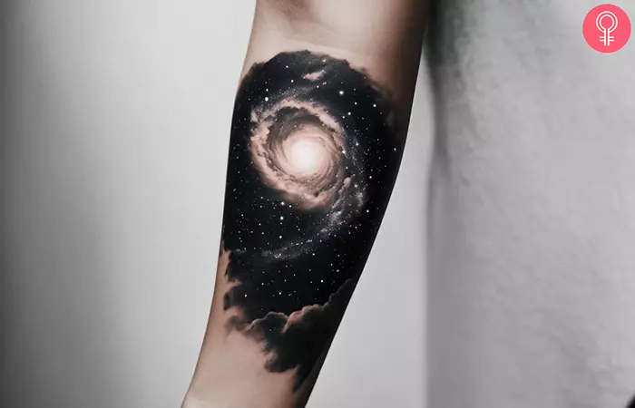 Black and white galaxy tattoo on the arm