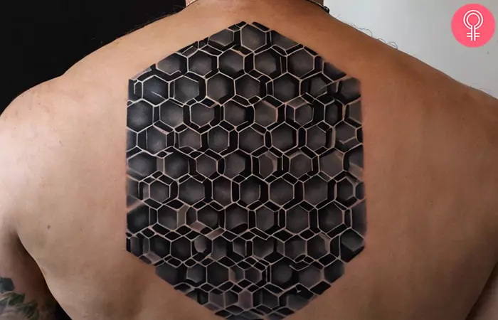 Black honeycomb tattoo on the back
