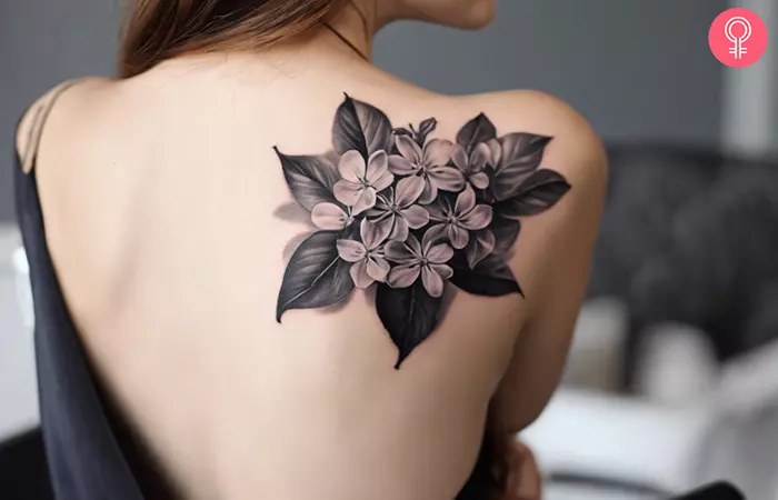 Black lilac tattoo on the back