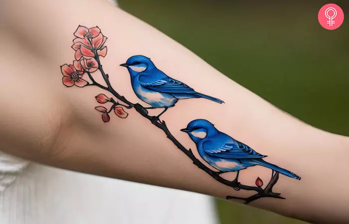 A tattoo showing bluebirds of happiness