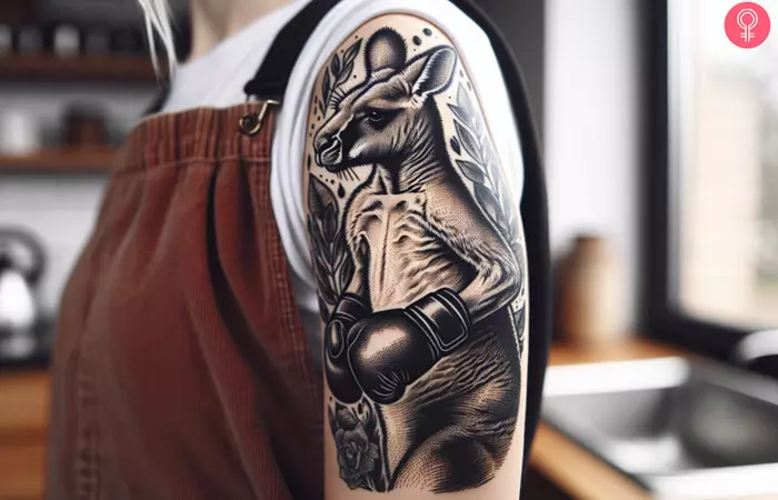 Woman with a tattoo of a boxing kangaroo on her upper arm