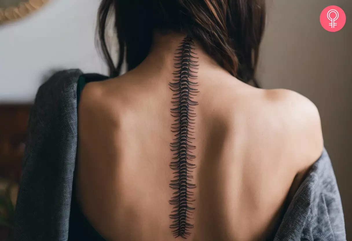 Centipede spine tattoo on the back